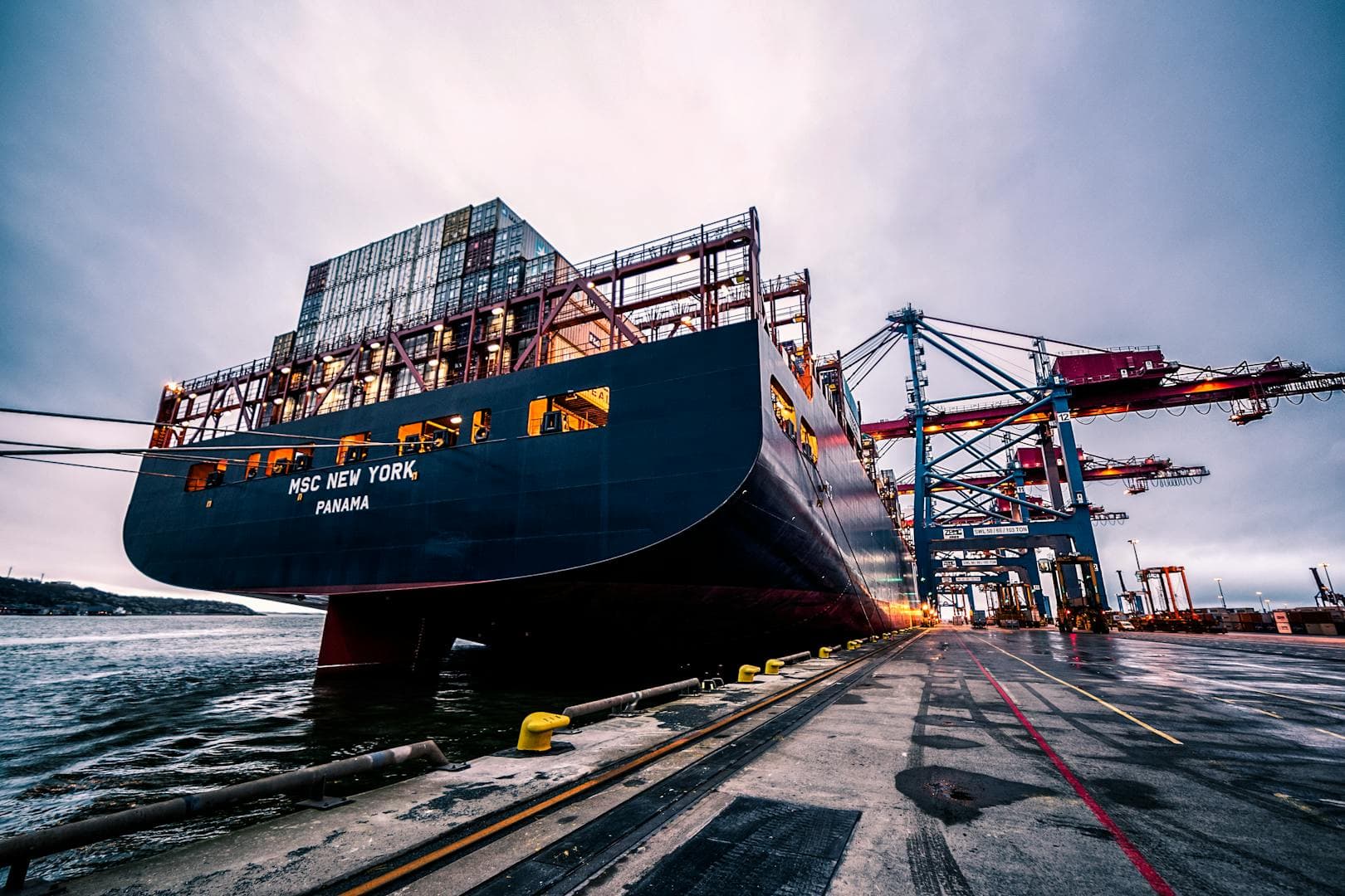 Container ship at dockside representing maritime industry safety challenges