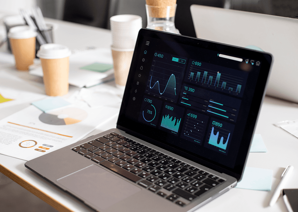 AI predictive analytics dashboard on a MacBook, representing Teesside business forecasting solutions